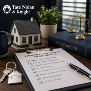 Lawyer assisting clients with a property transfer in South Africa, highlighting common delays in the conveyancing process.